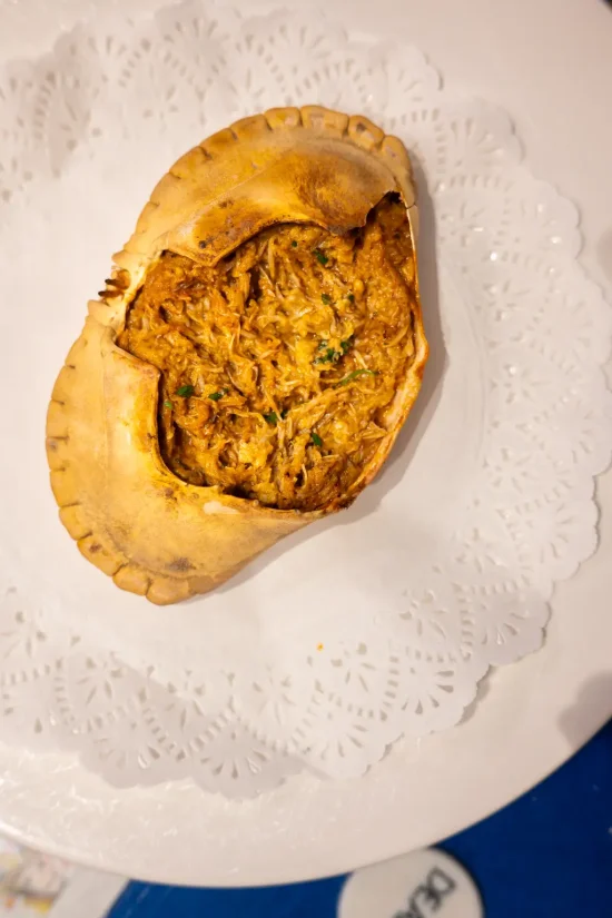 Txangurro al horno — baked spider crab meat in a golden roasted shell with parsley, on a lace doily at La Cepa de Bernardo, San Sebastián