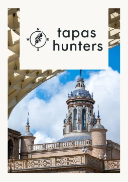 Architectural view of Seville showcasing historic tiled domes framed by the modern wooden structure of the Setas de Sevilla for Tapas Hunters Issue 06.